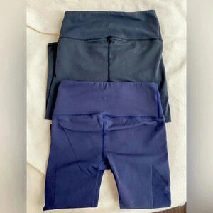 Lululemon set of cropped leggings with mesh on side 
Sz small navy blue & black